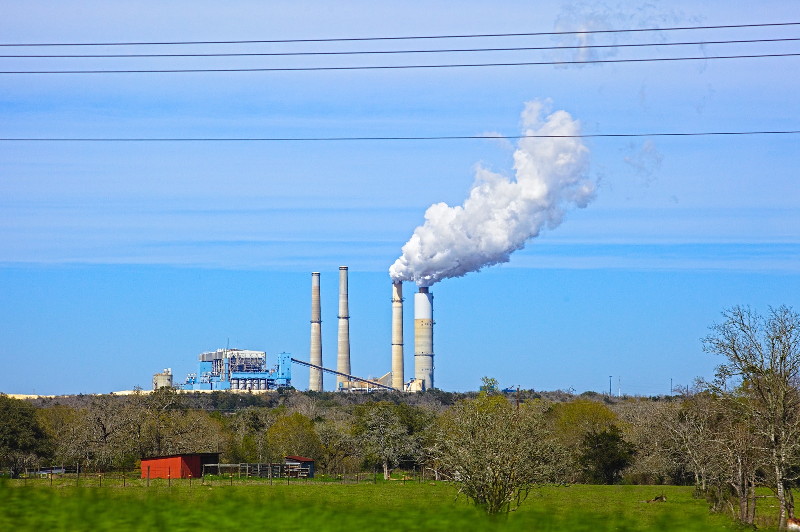 white smoke coming out from factory